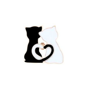 Black and white couple cat with gold