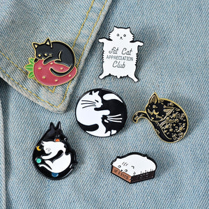Collection of cat themed brooches/pins